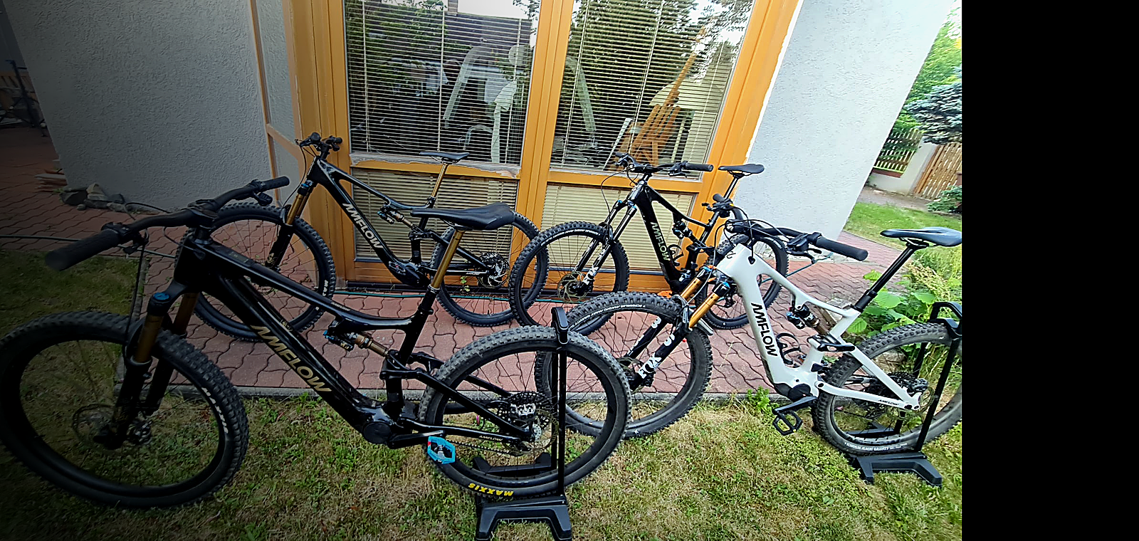 Amflow electric mountain bikes lined up outdoors